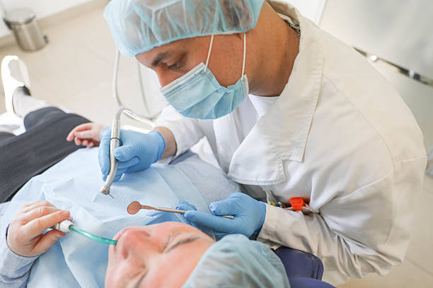 istock Dentist Concentrating During Dental Procedure 2222751095