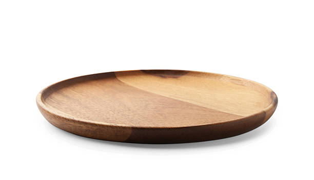 istock One wooden plate isolated on white. Tableware 2222754383