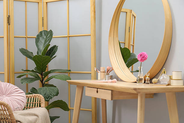 istock Mirror, dressing table, houseplant, folding screen and chair indoors. Interior design 2222754977