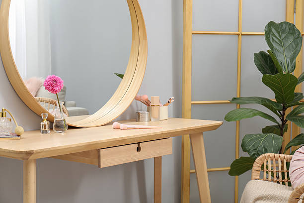 istock Mirror, dressing table, houseplant, folding screen and chair indoors. Interior design 2222754980