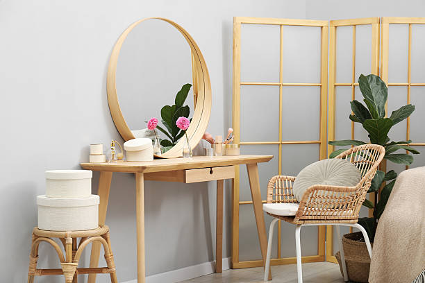 istock Mirror, dressing table, houseplant, folding screen and chair indoors. Interior design 2222755013