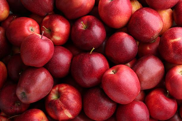 istock Fresh ripe red apples as background, top view 2222755757