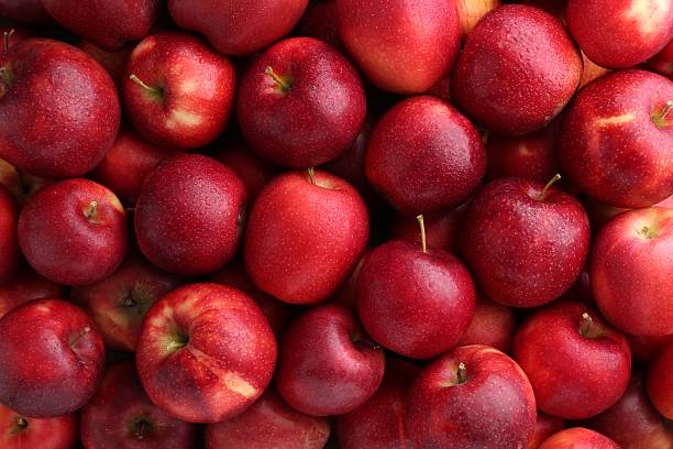 istock Fresh ripe red apples as background, top view 2222755801