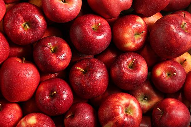 istock Fresh ripe red apples as background, top view 2222755813
