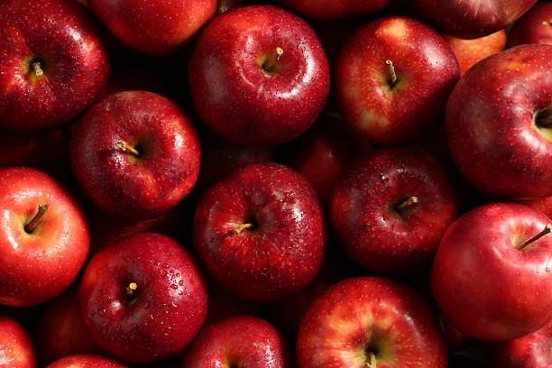 istock Fresh ripe red apples as background, top view 2222755814