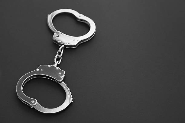 istock Classic chain handcuffs on black background, closeup. Space for text 2222756265