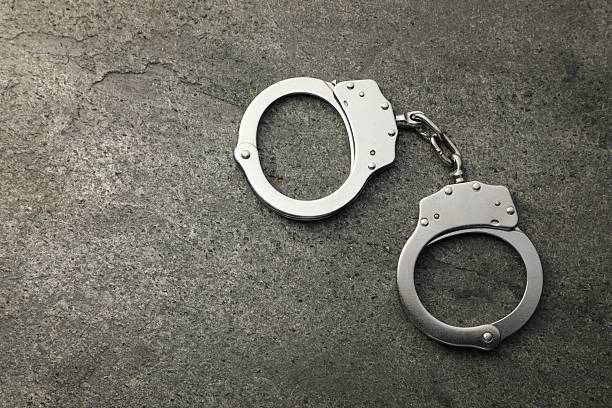istock Classic chain handcuffs on grey table, top view. Space for text 2222756343