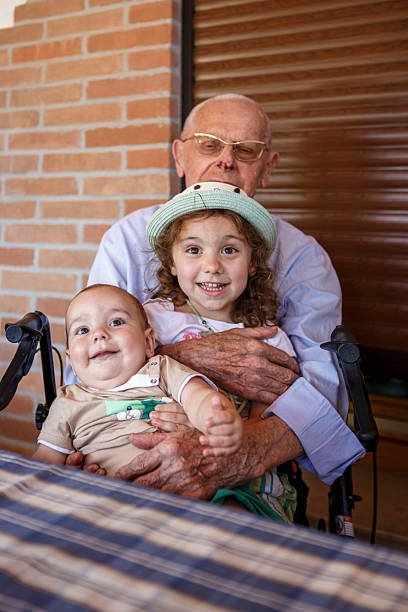 Disabled grandfather and grandchildren take a souvenir photoItaly, 2025