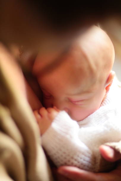 istock Woman Holding Baby (Reborn Baby Doll) 2222778774