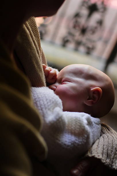 istock Woman Holding Baby (Reborn Baby Doll) 2222778792