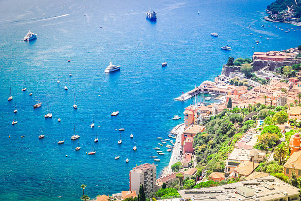 colorful coast and clear water with boats and ships, cote dAzur Provence, France