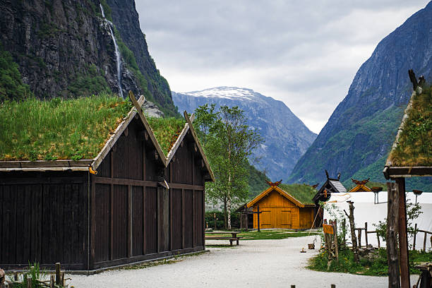 istock Traditional viking village, waterfall and mountains 2222780655