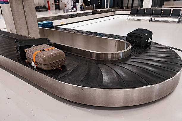 istock Suitcases on Baggage Claim Conveyor Belt 2222780684