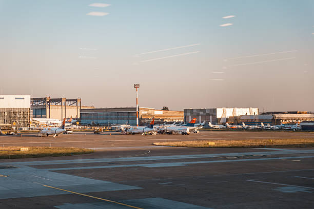 istock Commercial Aircraft at Gate with Hangars Behind 2222780967