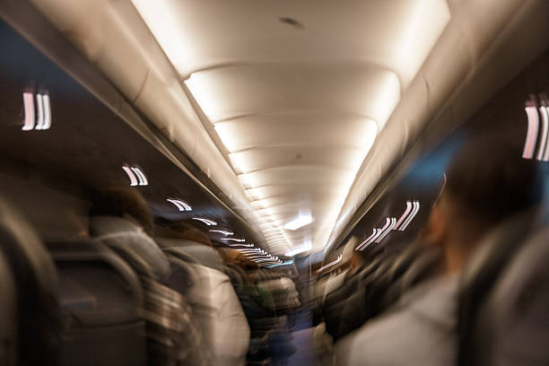 istock Light Streaks and Movement in Airplane Aisle 2222781482
