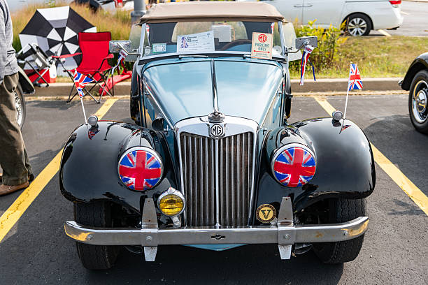 Leiria, Portugal September 29, 2024, Shiny black mg td convertible is parked on a grassy field