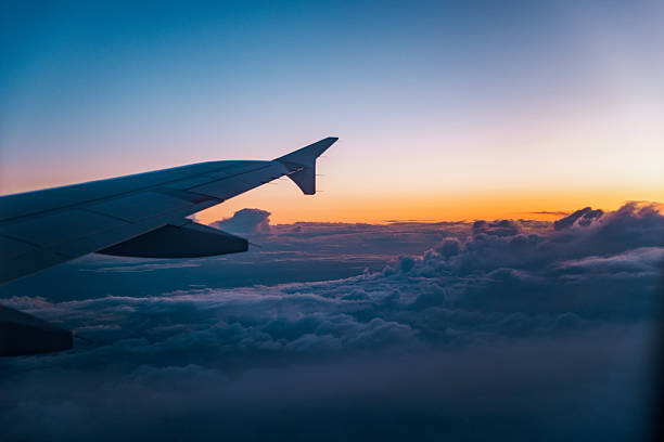 istock Aircraft Wing in the Sky Over Clouds 2222783432