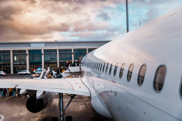 istock Passengers Boarding an Aircraft at Sunset 2222783497