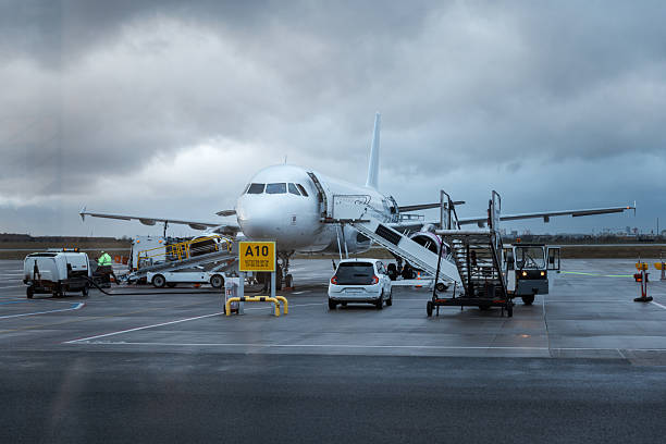 istock Aircraft Boarding at Gate During Stormy Weather 2222784041