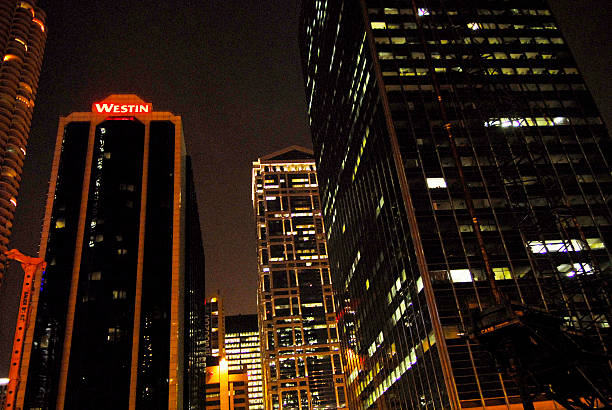 Chicago, Il-October 22. 2024: Skyscraper architecture. Chicago city cityscape. Cityscape night with skyscraper building. Skyline architecture. Chicago city with illuminated building. Night Chicago city downtown. Night city mood.