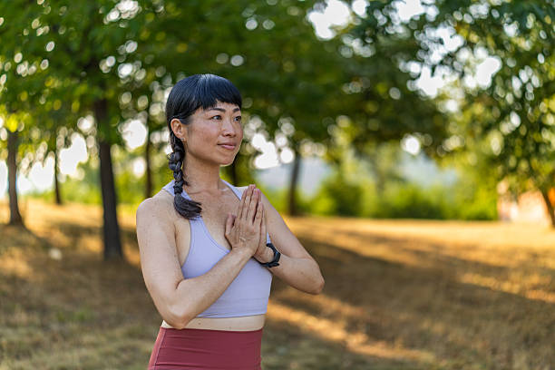istock Beautiful Japanese woman practicing yoga concept, standing in Tree pose. 2222787203