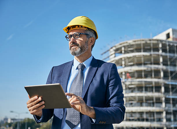 istock businessman construction site business architect building engineer builder tablet helmet architecture blueprint worker man contractor adult engineering industry 2222787422