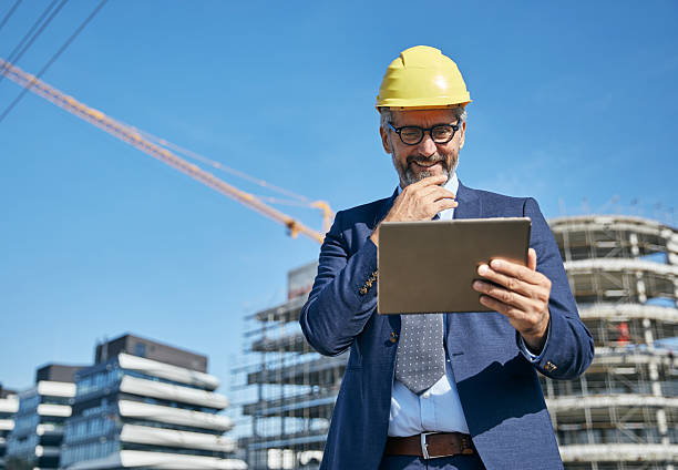 istock businessman construction site business architect building engineer builder tablet helmet architecture blueprint worker man contractor adult engineering industry 2222787447