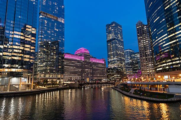 istock Chicago architecture of skyscraper at river. City night illuminated building. Skyscraper cityscape. Night city of Chicago, Illinois. Business city. Night cityscape of Chicago skyscraper building 2222787592