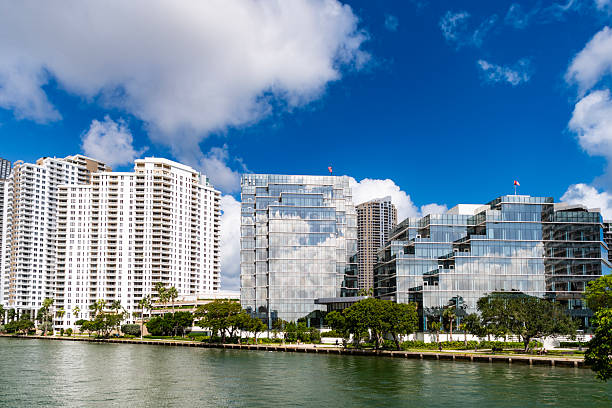 Skyscraper building architecture. Skyscraper with glassy facade. Modern glass building. Skyscraper in business city. City downtown with skyscraper. Office building in business district. Brickell Key