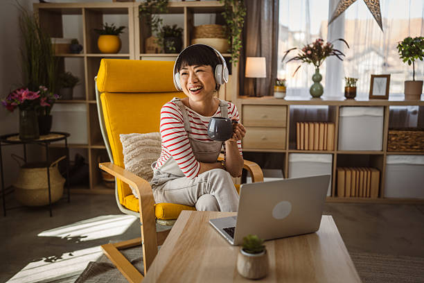 istock mature japanese woman work from home on laptop while drink coffee 2222790884