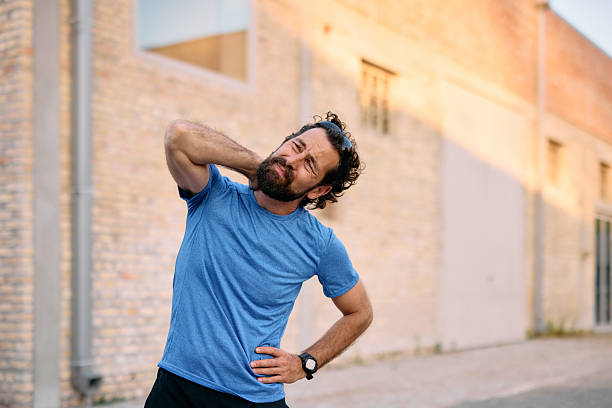 istock Sportsman feeling neck and side pain during workout 2222794600