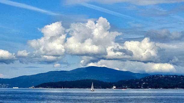 istock Cloudscapes as seen from Vancouver's Seawall Greenway Pedestrian Footpath on the cloud-filled sunny blue sky day of June 28, 2025. 2222795190