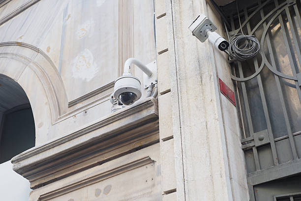 istock Security cameras mounted on a building wall in an urban area 2222800117