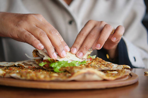 istock woman Preparing fresh turksih Lahmacun 2222802534