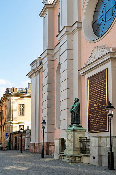 St Nicholas Cathedral facade with statue and plaque in Stockholm