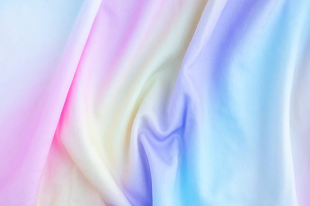 istock Abstract colorful rainbow color fabric soft wave smooth texture surface background 2222805933