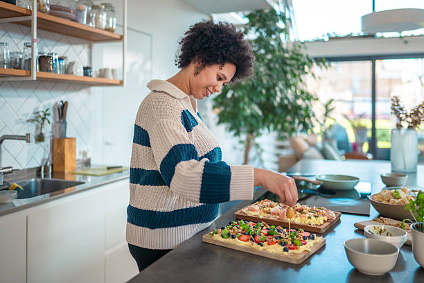 Mixed Race Woman Adding Honey to Butter Board