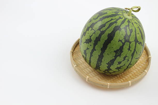 Ripe striped watermelons at the street market