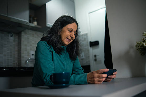 istock Mature woman playing a mobile game 2222815015