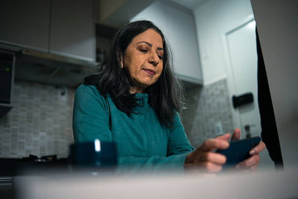 istock Mature woman playing a mobile game 2222815022