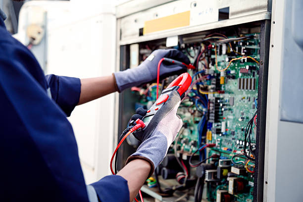 istock Air conditioning technicians and those preparing to install new air conditioners use a multimeter to check the operation of the compressor control panel system. 2222815629