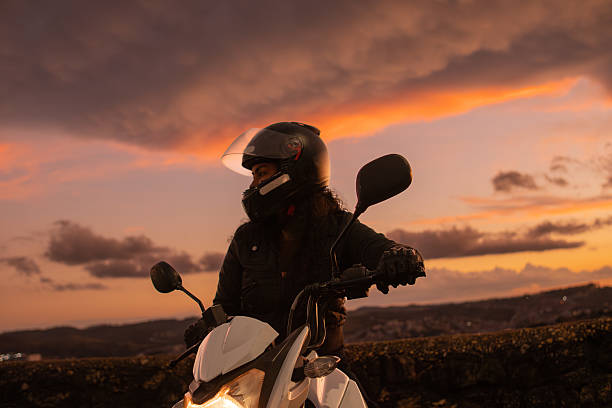 Biker woman mountain sunset landscape