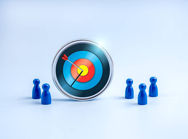 istock Stakeholder, business connection, cooperation, teamwork and team building concept. Big 3d modern target icon and human doll figure group as businessman standing together, isolated on blue background. 2222823039