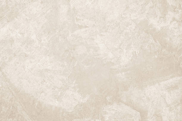istock Colour old concrete wall texture background. Close up retro plain cream color cement wall background texture. Design paper vintage parchment element. 2222825294