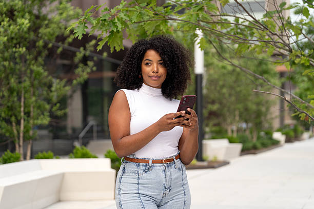 istock Black woman using a mobile phone in the city 2222827455