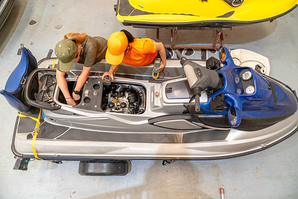 istock Two female mechanics repairing personal watercraft engine in workshop 2222827965
