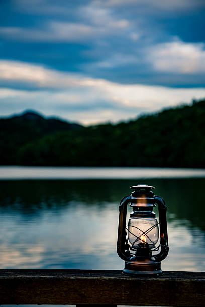 istock Light an oil lantern by the lake. 2222834363