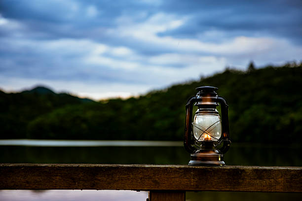 istock Light an oil lantern by the lake. 2222834377