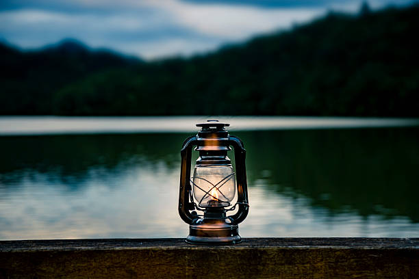 istock Light an oil lantern by the lake. 2222834389