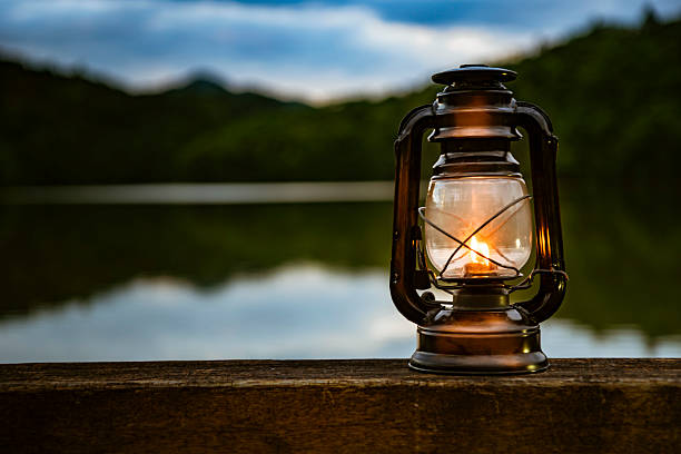 istock Light an oil lantern by the lake. 2222834392